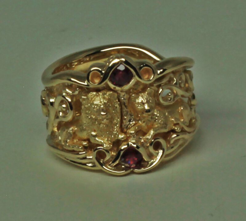 Lions & Dragon ring in gold with rubies